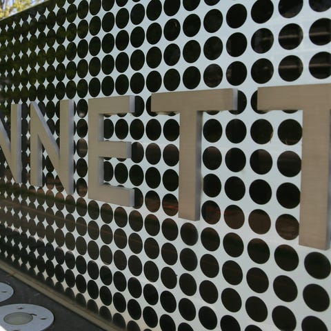 A sign in front of Gannett Co Inc, headquarters is