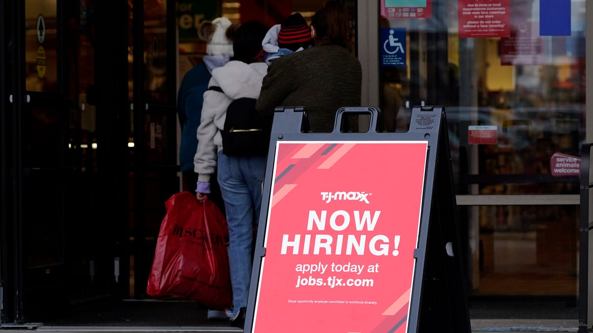 A hiring sign is displayed outside of a retail store in Vernon Hills, Ill., Saturday, Nov. 13, 2021.