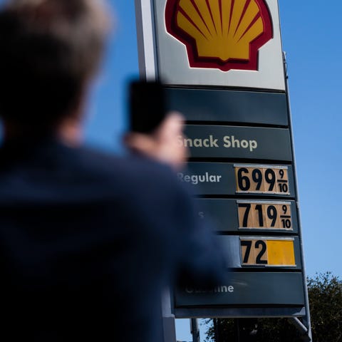 Martin Bruinsma, 65, takes pictures of gas prices 