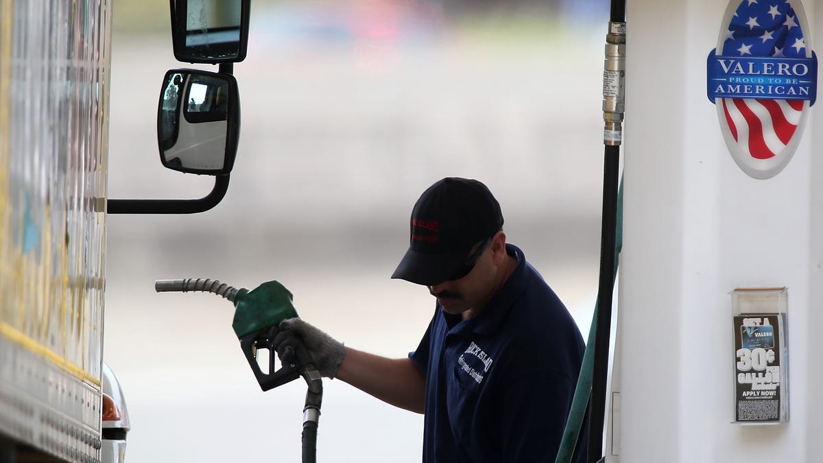 A customer prepares to pump gas into his truck at a Valero gas station on July 22, 2013 in Mill Valley, California.