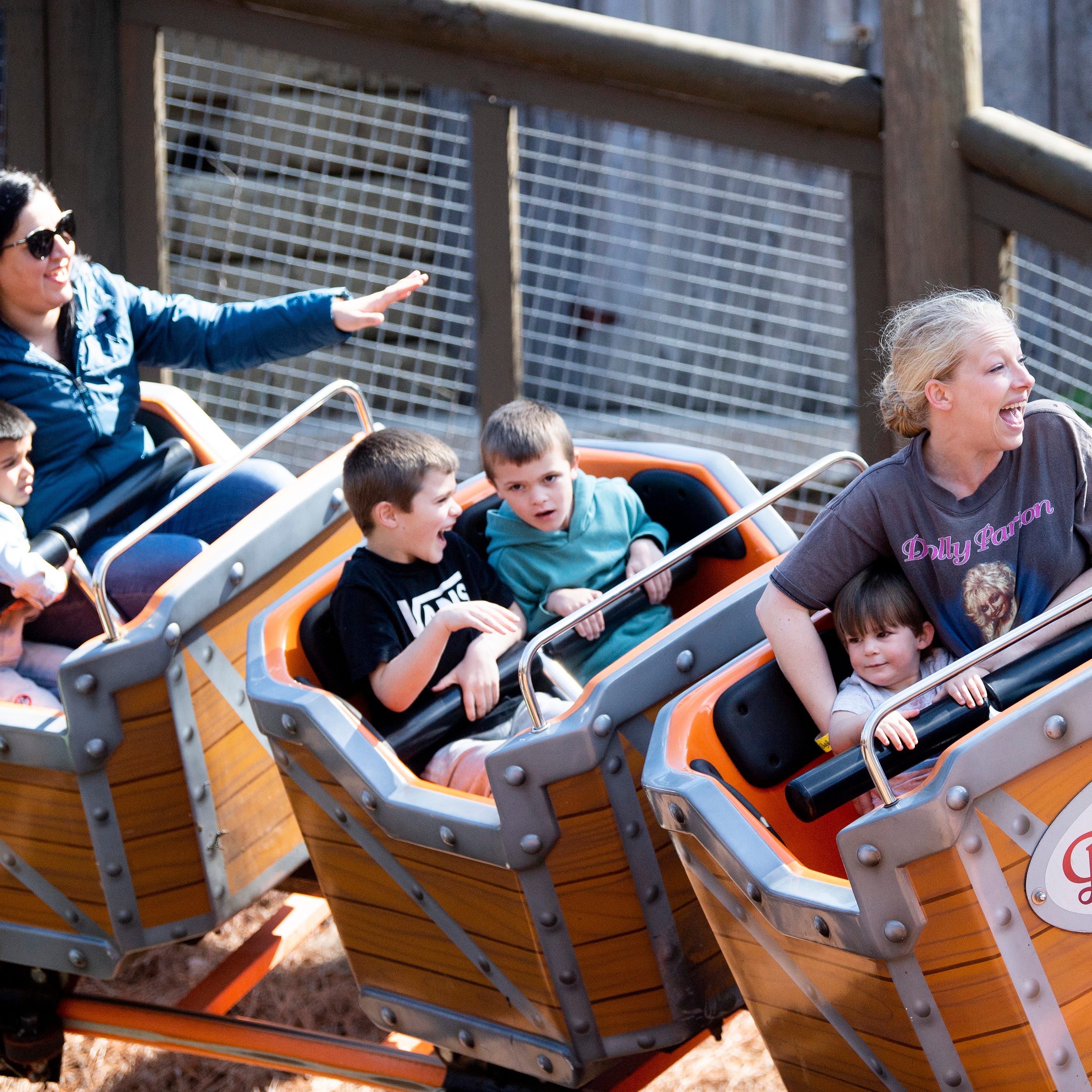 Guests enjoy the Whistle Punk Chaser ride on opening day at Dollywood on Friday, March 11, 2022.