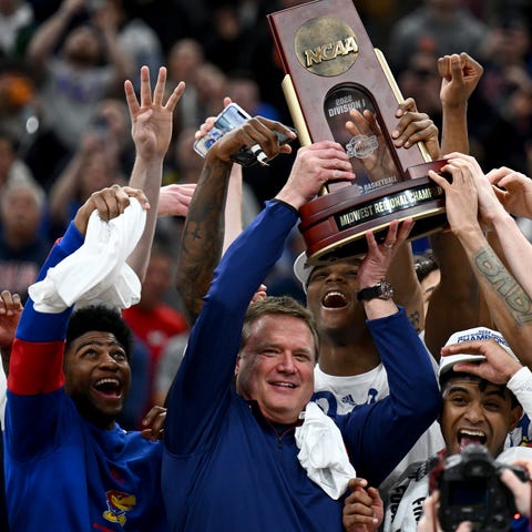 Kansas coach Bill Self celebrates with his team af