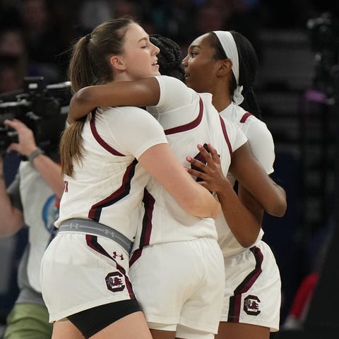 Gamecocks players celebrate after defeating the Ca