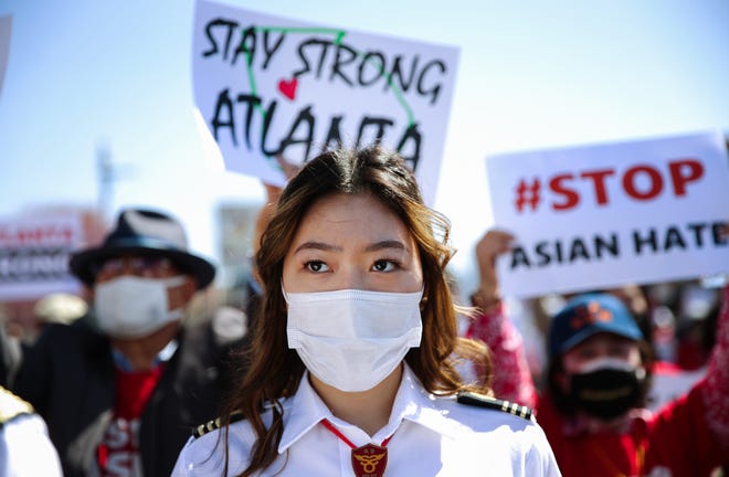 People demonstrate at a rally against hate incidents targeting Asians in Los Angeles' Koreatown district on March 27, 2021.