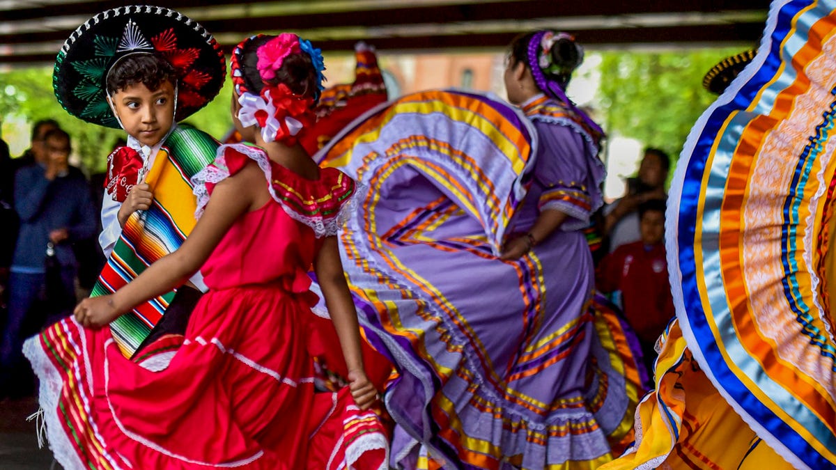 Christian Gonzalez, 9, and Jayliah Villa, 7 perform Mexican folk dance with Baile Folklorico Raices Mexicanas in Passaic, New Jersey, on Cinco de Mayo May 5, 2019.