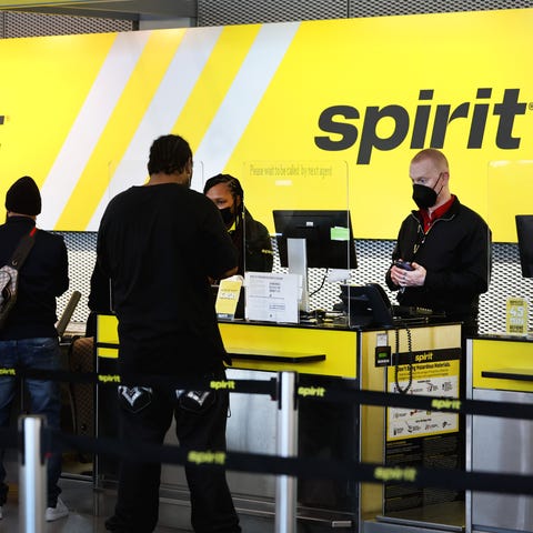 Passengers check-in for flights with Spirit Airlin