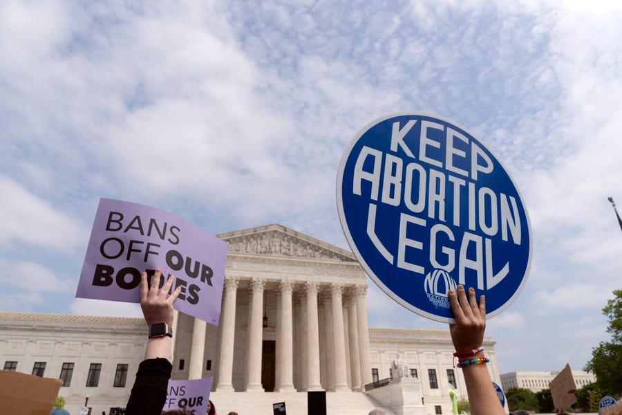 Demonstrators protest outside of the Supreme Court on May 3, 2022.