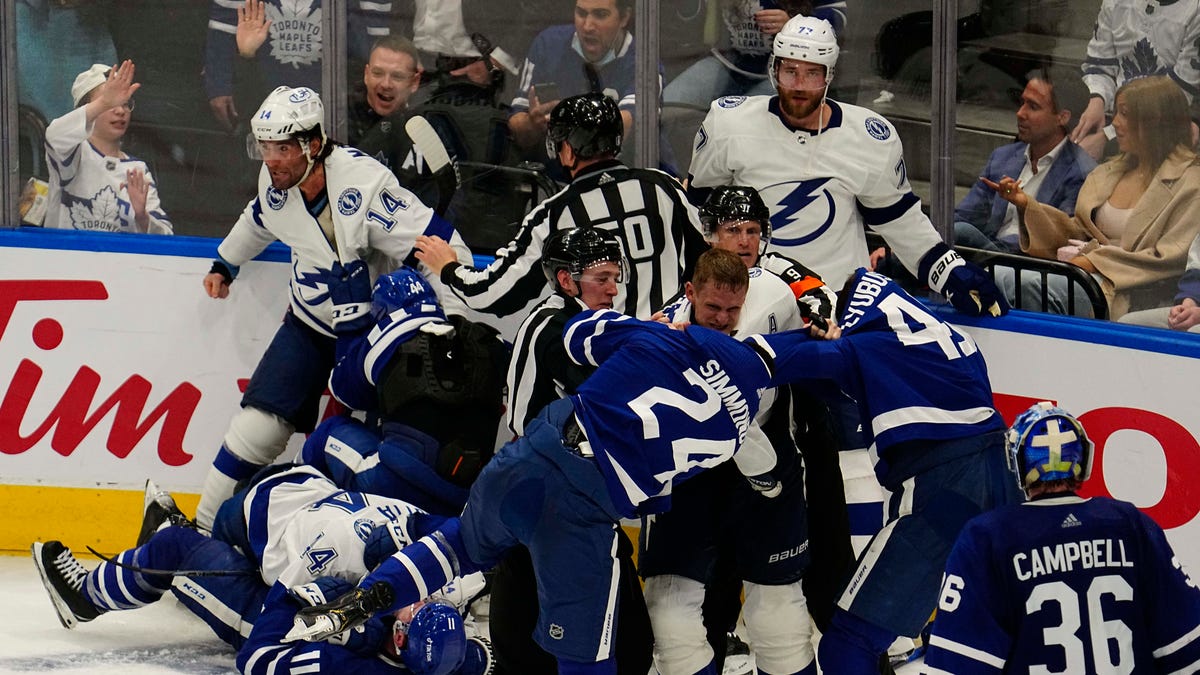 The Tampa Bay Lightning and Toronto Maple Leafs have a line brawl during the third period of Game 1.