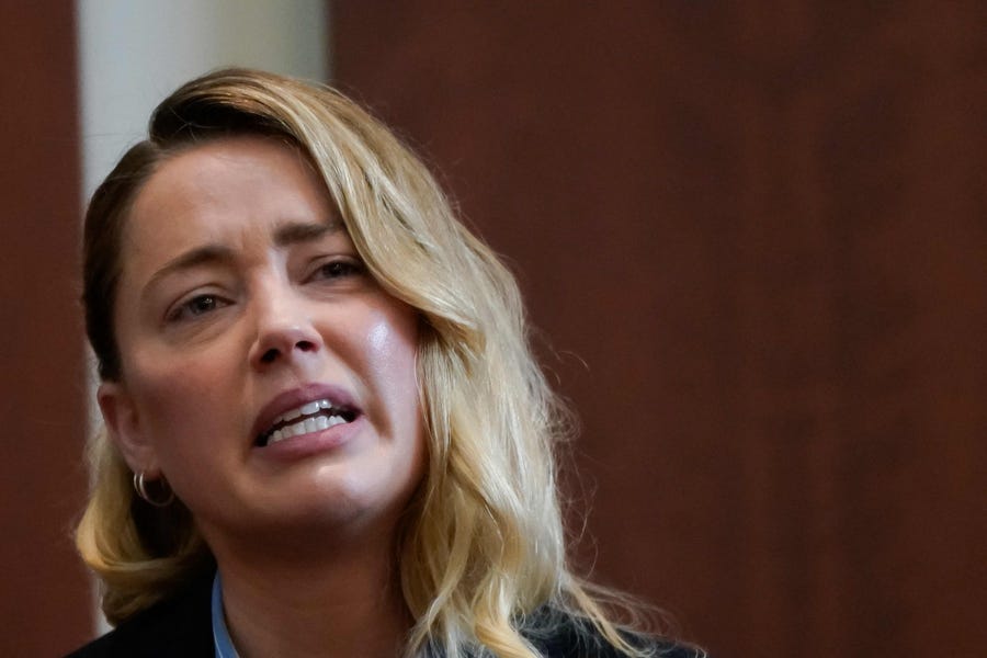 Actor Amber Heard testifies about the first time her ex-husband, actor Johnny Depp hit her, at Fairfax County Circuit Court during a defamation case against her by Depp in Fairfax, Virginia, on May 4, 2022.