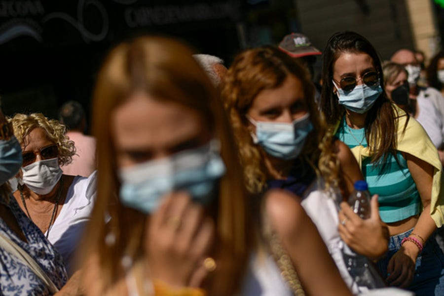 People wearing face masks to prevent the spread of COVID-19 attend a summer flamenco festival in Pamplona, northern Spain, on Aug. 26, 2021.