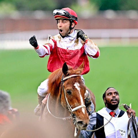 Jockey Sonny Leon celebrates after Rich Strike's v