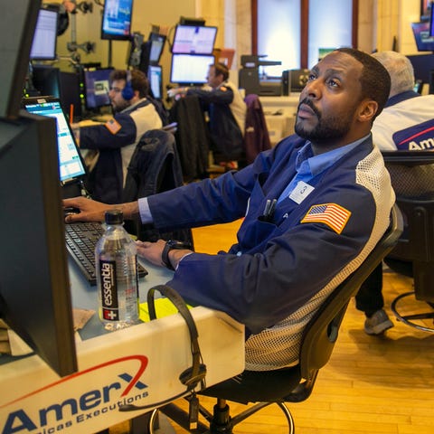 Traders work on the New York Stock Exchange floor 