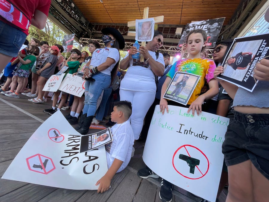 Demonstrators gather around the stage as they listen to speakers Friday in front of the NRA convention on May 27, 2022 in Houston.