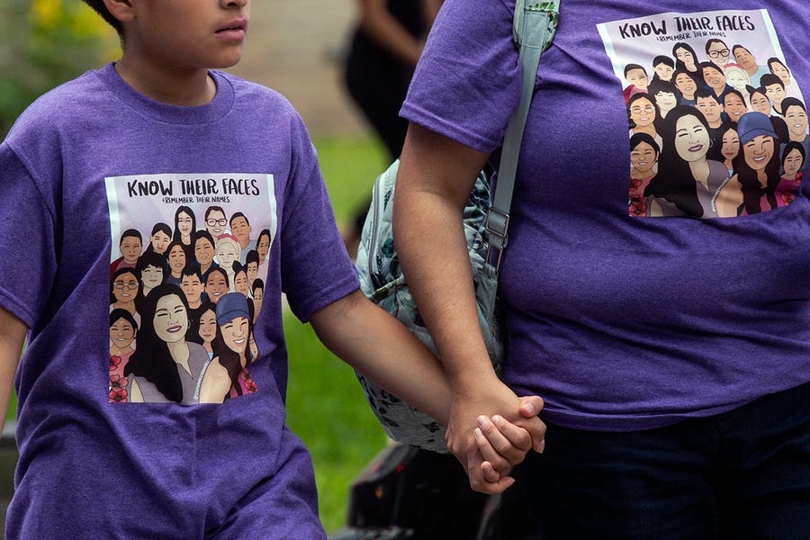 A woman and boy hold hands after attending the funeral mass of 10-year-old Amerie Jo Garza at Sacred Heart Catholic Church in Uvalde, Texas on Tuesday, May 31, 2022.