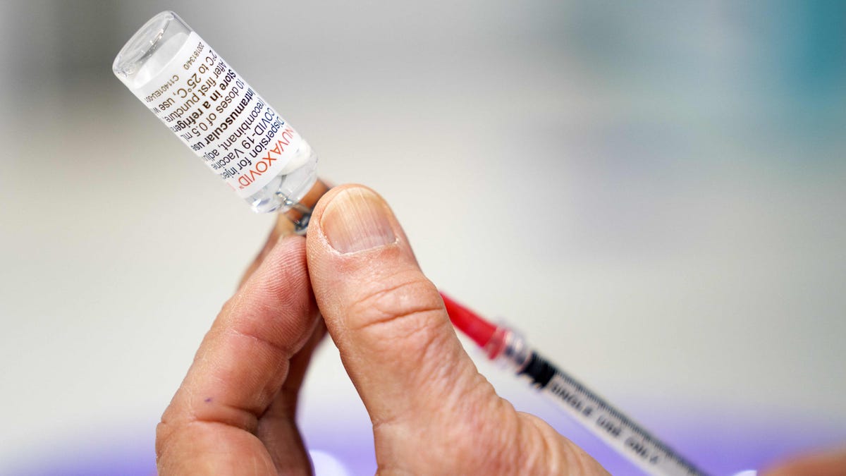 A health care worker prepares a dose of Nuvaxovid vaccine from Novavax in Utrecht, Netherlands, on March 15. Unlike mRNA vaccines, Nuvaxovid does not need to be stored in ultra-low temperatures, giving it a logistical advantage in difficult-to-access regions.