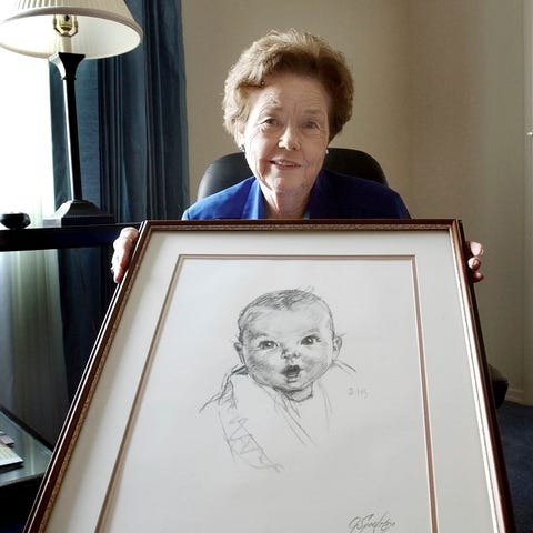 Ann Turner Cook, poses at her Tampa, Fla., home on