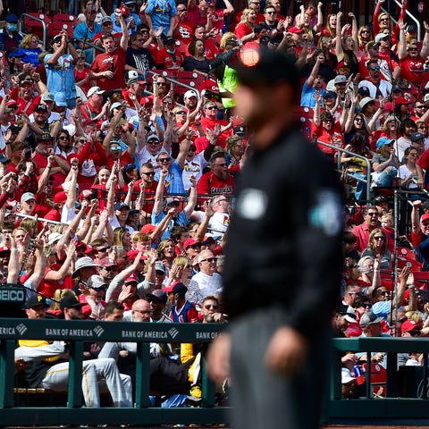 Cardinals fans react after a call was overturned d