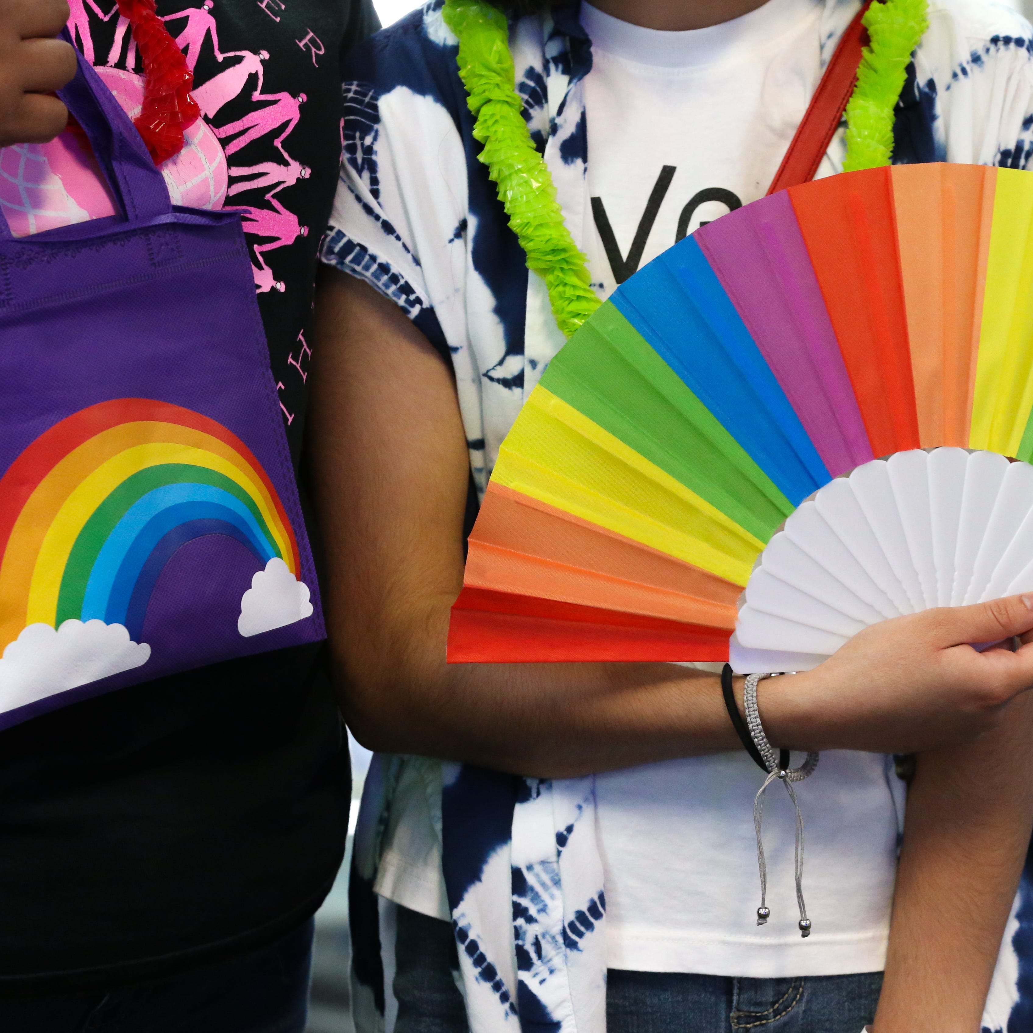 Cristina Macias, left, and Lotus Macias hold up goodies they received from Pride Corpus Christi's organization at In the Game Funtrackers Thursday, June 9, 2022.