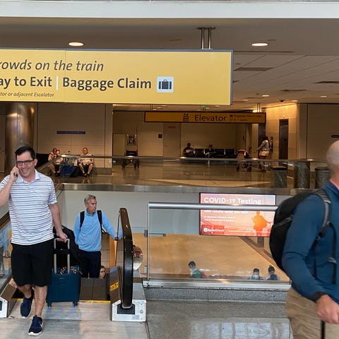 A sign at Denver International Airport directs fly