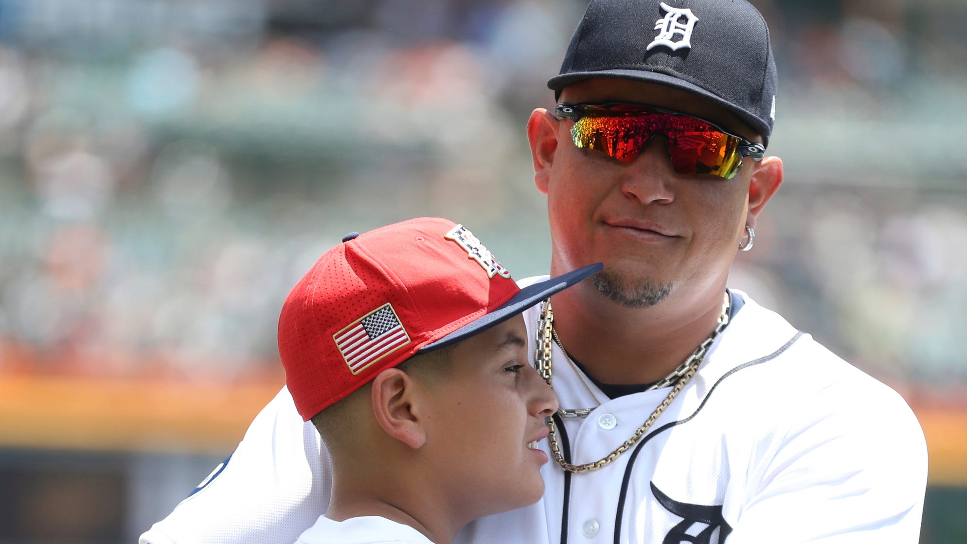 Detroit Tigers DH Miguel Cabrera (24) was honored for his 3,000 hits and 500 homers before the game against the Toronto Blue Jays on Sunday, June 12, 2022. Cabrera embraces his son, Christopher, after the ceremony.