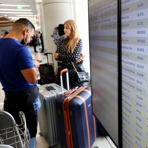 Travelers gather in the Delta terminal at Los Ange