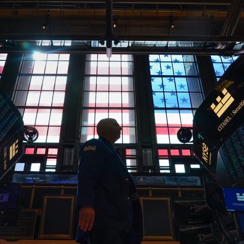 Traders work on the floor at the New York Stock Ex