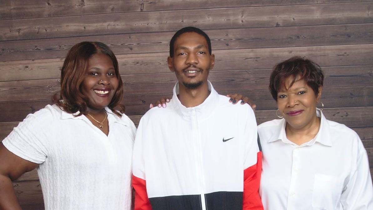 Jayland Walker with his mother, Pamela, right, and sister, Jada.