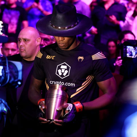 Israel Adesanya walks out for his bout against Jar