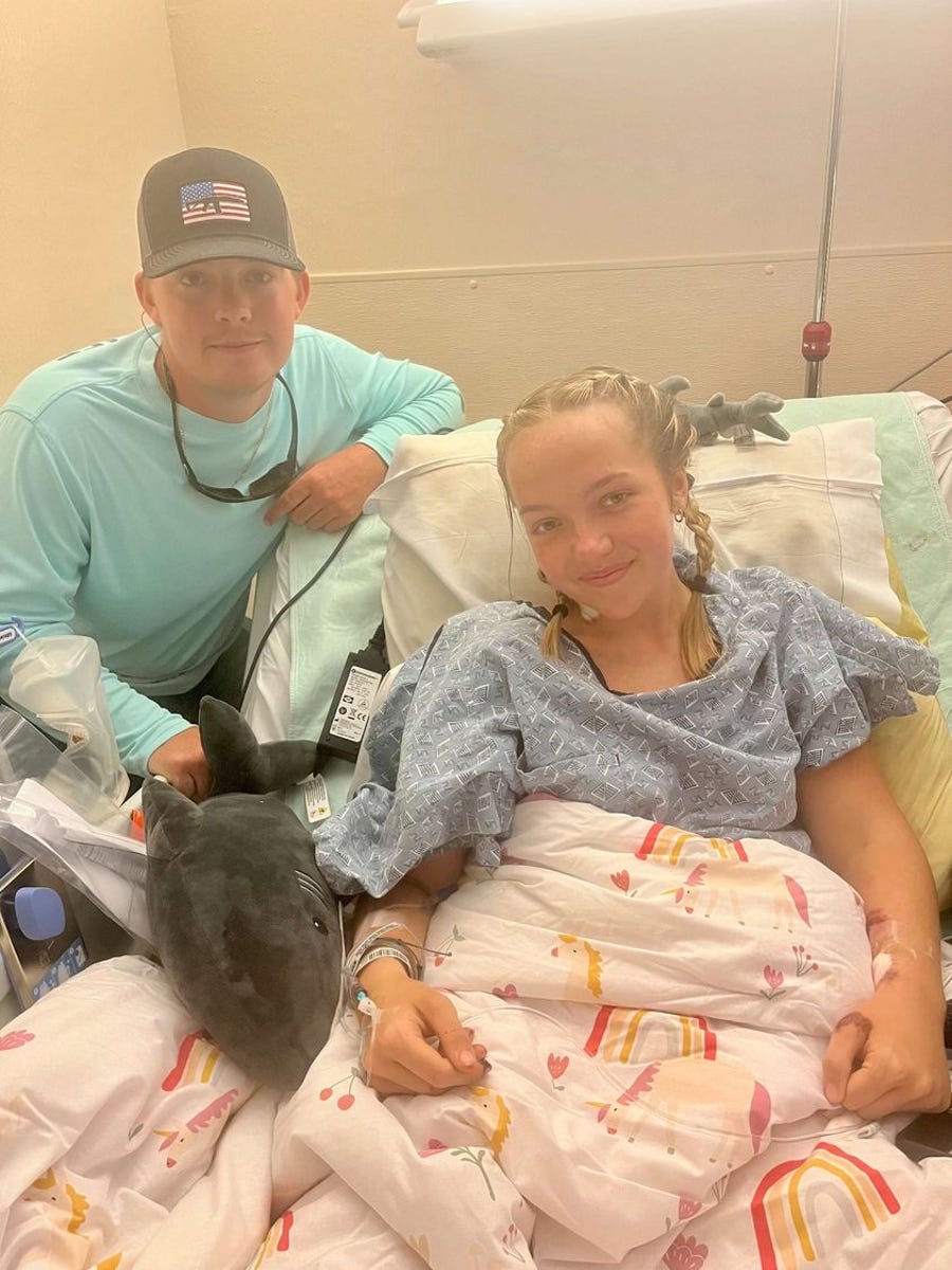 Rhett Willingham, left, and Addison Bethea, right, pose for a photo days after she was attacked by a shark near Keaton Beach in Taylor County.