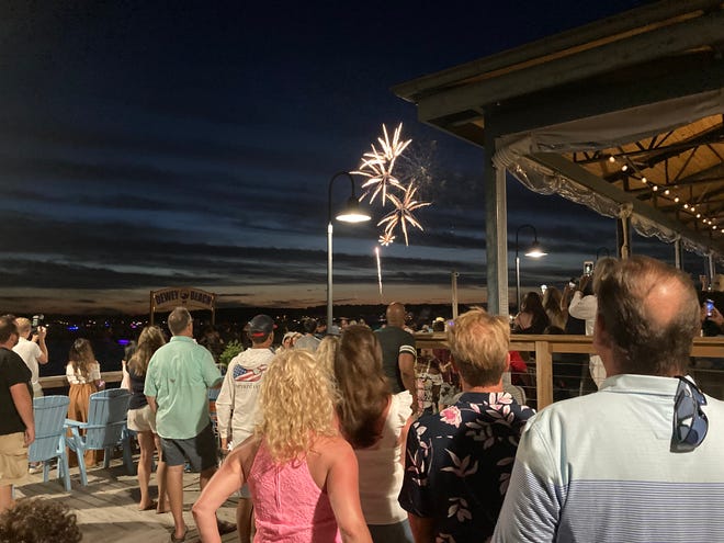 Fireworks launch over Rehoboth Bay in Dewey Beach on Monday, July 4, 2022.