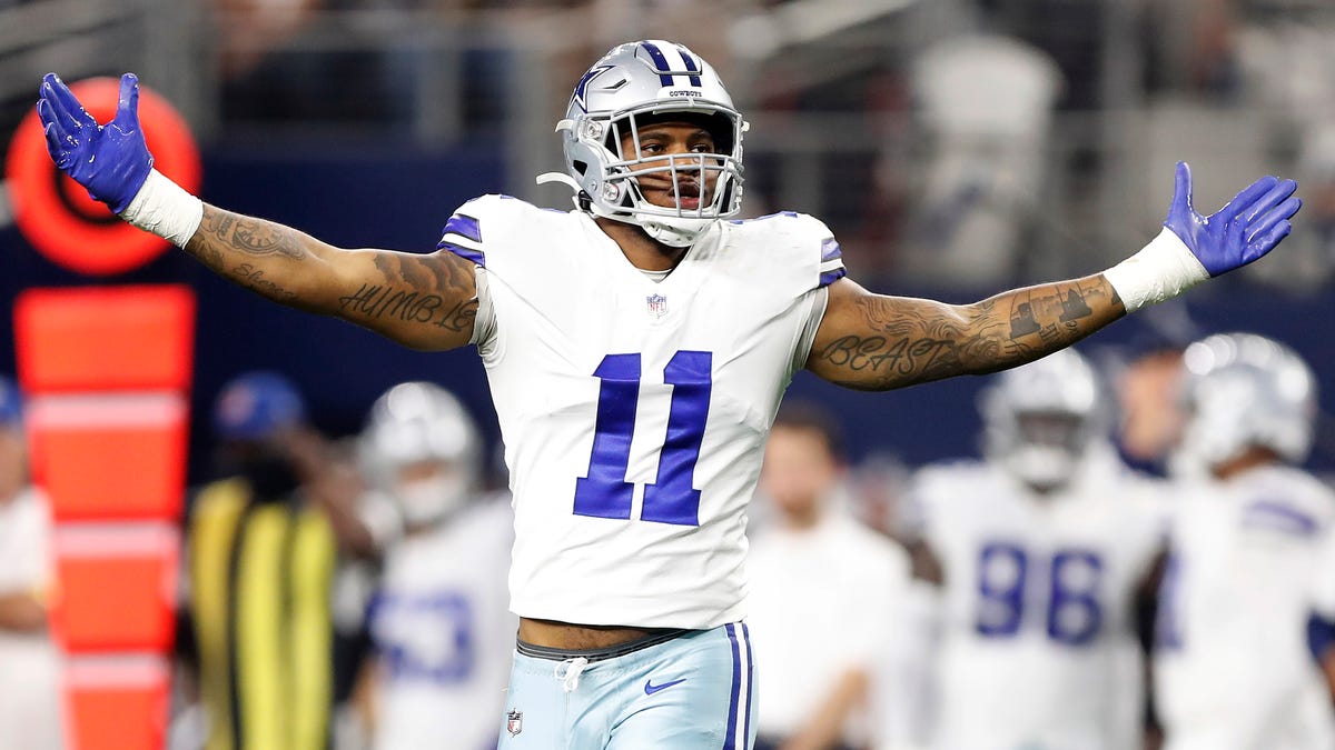 Micah Parsons #11 of the Dallas Cowboys celebrates after a sack during the second half against the Washington Football Team at AT&T Stadium on December 26, 2021 in Arlington, Texas.