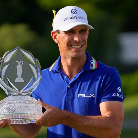 Billy Horschel stands with the trophy after winnin