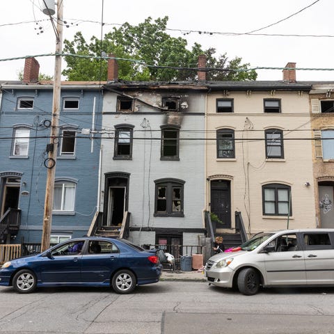 The scene of a fatal fire at 68 Lander Street in t