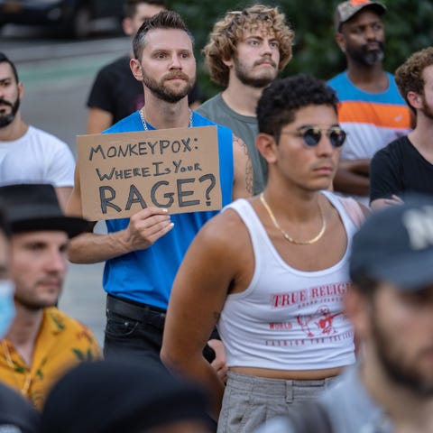 People protest during a rally calling for more gov