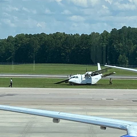 The twin-engine CASA CN-212 Aviocar after it lande