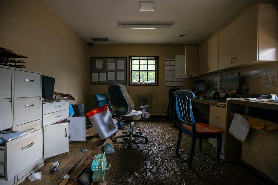 Mud covers the floor of the front office at the MCHC Isom Medical Clinic in Isom, Ky., on Monday, Aug. 1, 2022.