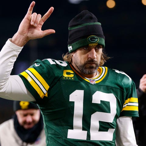 Aaron Rodgers walks off the field after a 2021 gam