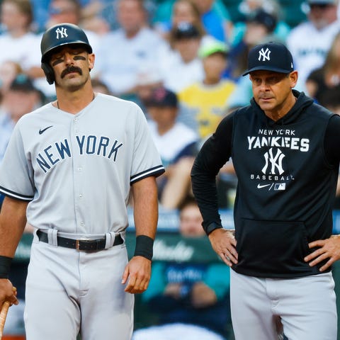 Yankees' Matt Carpenter (left) reacts while manage