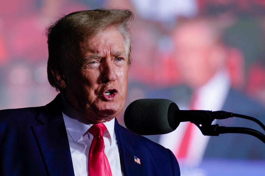 Former President Donald Trump speaks at a rally  Aug. 5 in Waukesha, Wis. The FBI search of Trump's Mar-a-Lago estate marked an unprecedented escalation of the law enforcement scrutiny of the former president, but the Florida operation is just one investigation related to Trump and his time in office.