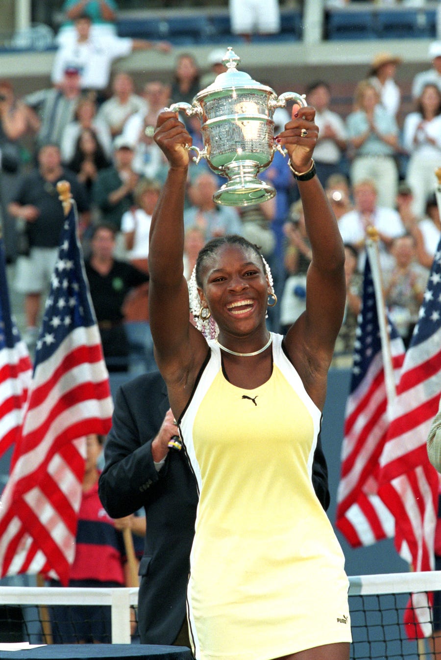 11 Sep 1999: Serena Williams poses with her trophy after winning the US Open at the USTA National Tennis Courts in Flushing Meadows, New York.