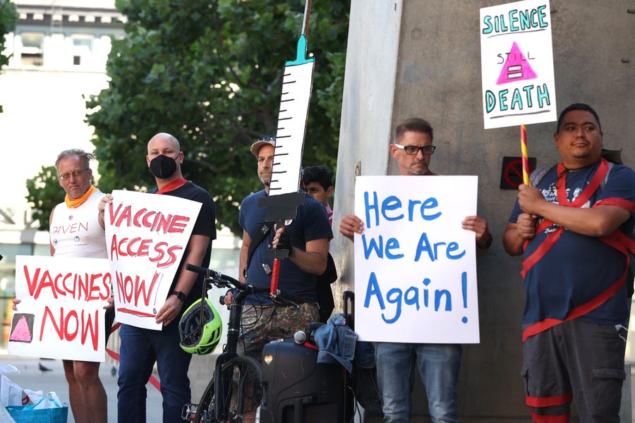 Healthcare and LGBTQ rights activists holds signs as they stage a protest outside of the San Francisco Federal Building on August 08, 2022 in San Francisco, California.