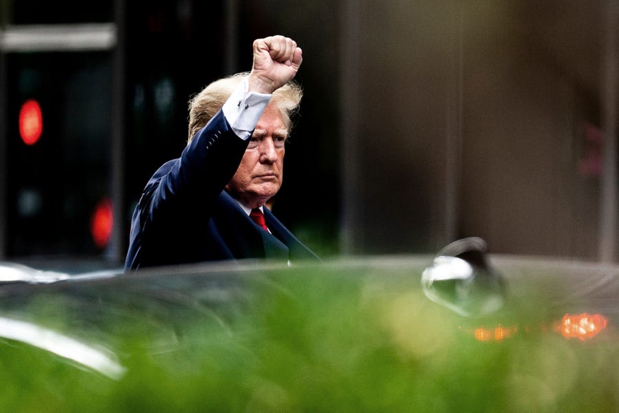 Former President Donald Trump gestures as he departs Trump Tower, Wednesday, Aug. 10, 2022, in New York, on his way to the New York attorney general's office for a deposition in a civil investigation. (AP Photo/Julia Nikhinson) ORG XMIT: NYJN106