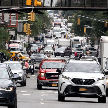 Vehicles and pedestrians share Ninth Ave. in Manhattan Aug. 11, 2022. The Metropolitan Transit Authority is moving towards a congestion pricing program that would charge drivers to enter midtown Manhattan.