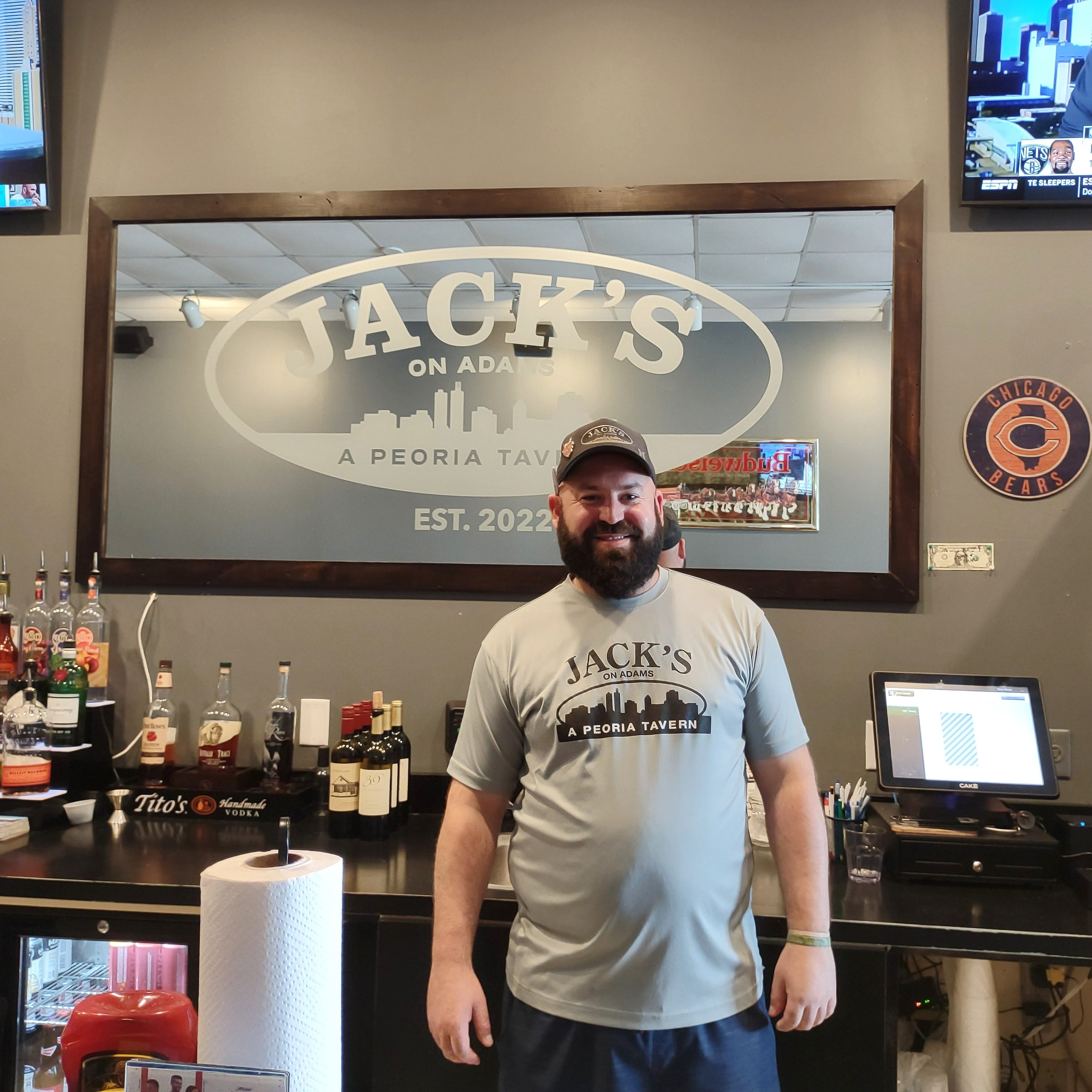 Jack Berres, owner of Jack's on Adams, stands inside his restaurant at the bar.