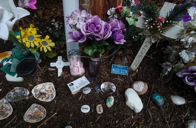 A memorial to Madison Sparrow stands in front of Maclary Elementary School nearly two years after she was murdered in a wooded park adjacent to the school.