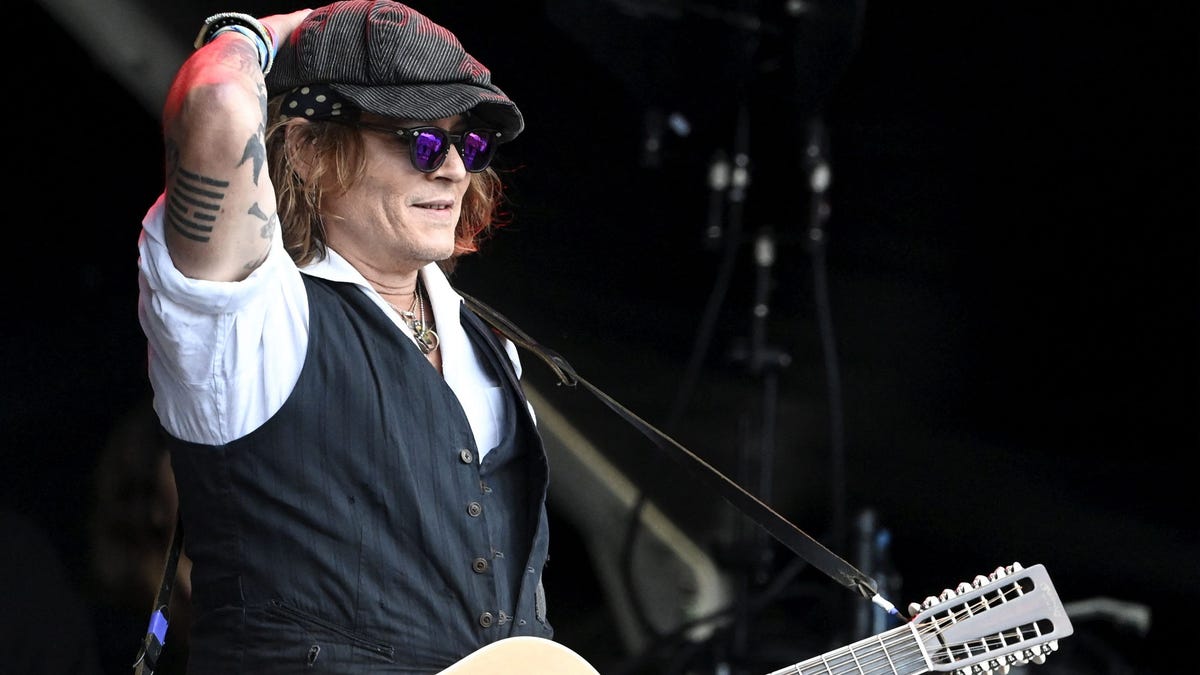 Johnny Depp performs on stage with Jeff Beck during the Helsinki Blues Festival in Helsinki on June, 19, 2022.