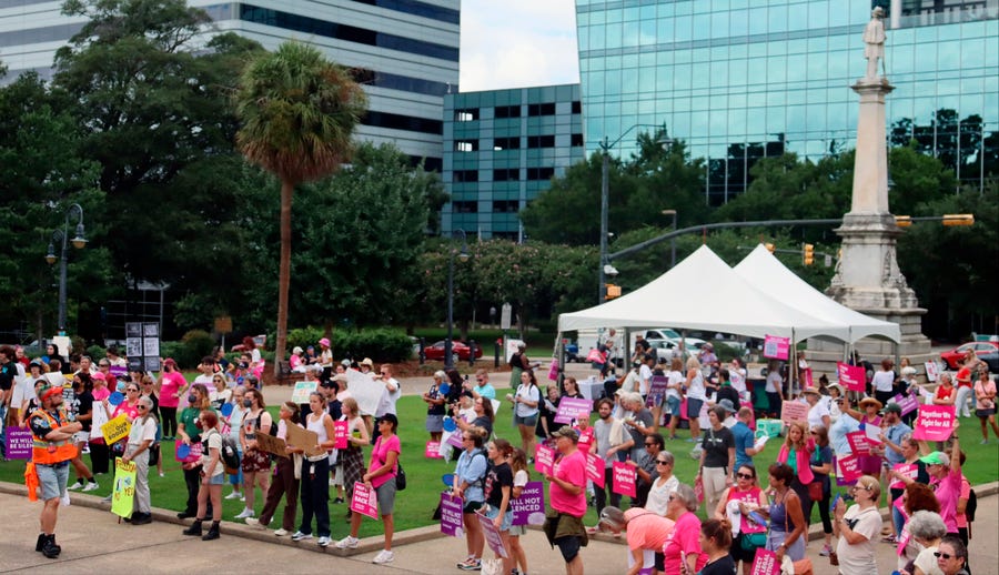 Protesters gather outside the state house in opposition to a proposed abortion ban debated Tuesday, Aug. 30, 2022 by the South Carolina House of Representatives in Columbia, South Carolina. State lawmakers voted Tuesday evening to pass an amended version of its near-total abortion ban.