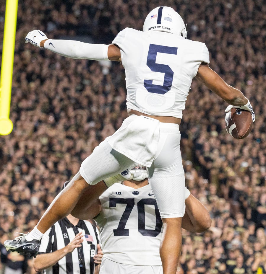 Penn State wide receiver Mitchell Tinsley (5) celebrates his touchdown in the second quarter against Purdue Boilermakers at Ross-Ade Stadium on Thursday night.