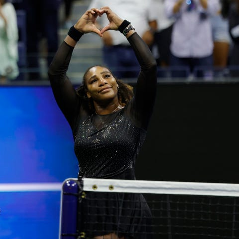 Serena Williams gives a heart to the crowd after f