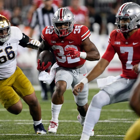 Ohio State running back TreVeyon Henderson (32) ca